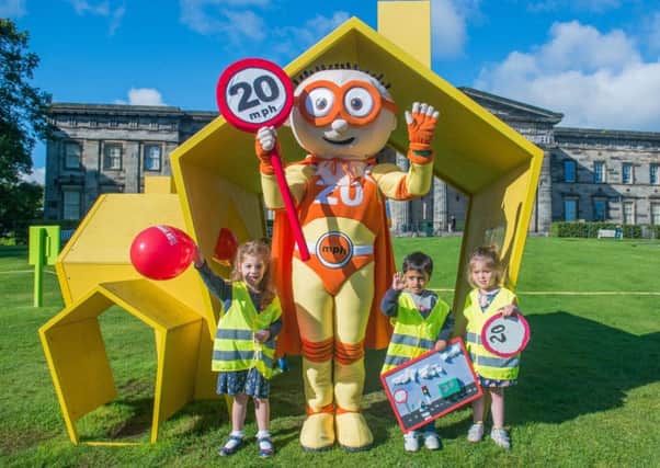 Council mascot The Reducer launches the next phase of the 20mph roll-out with children from the Murrayfield Nursery. Picture: Ian Georgeson