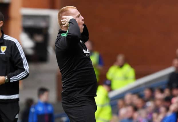 Lennon cups his ears as he celebrates Murray's equaliser. Picture: SNS Group