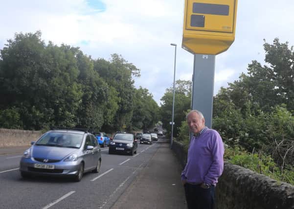 Ken Brown Penicuik Community Council Vice Charman at the new Glencouse Golf Club speed camera.