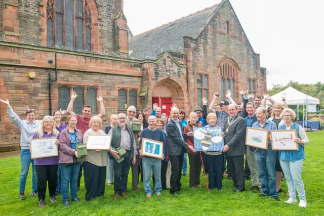 Lord Provost Frank Ross and Cllr Gavin Corbet with volunteers and service users at Polwarth Parish Church. Picture: Ian Georgeson