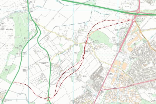 The dotted red line shows the relief road options on the right and the spur road on the left.