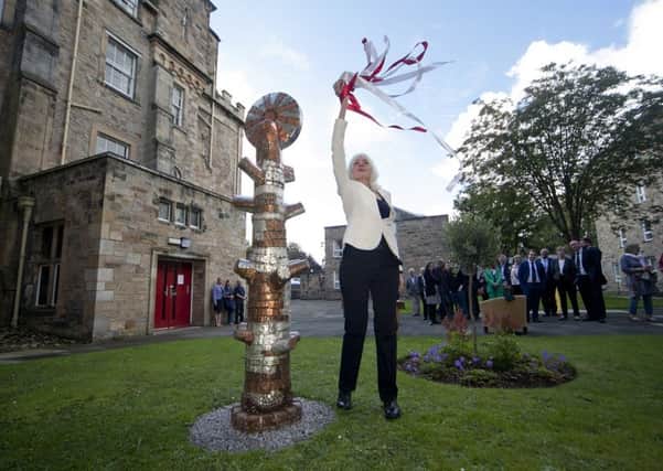 Paula untied the Latvian colours on the Tree of LIfe which she gifted the college.