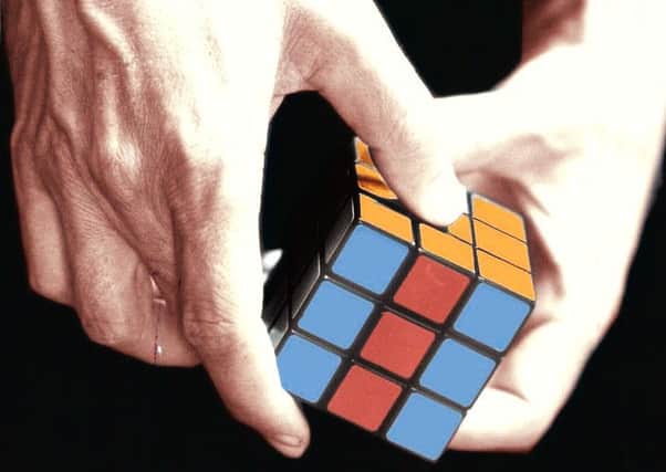 Up to one million Rubiks Cubes are faked every year