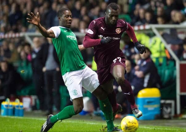 Marvin Bartley of Hibs and Hearts striker Esmael Goncalves will meet on December 27. Pic: SNS
