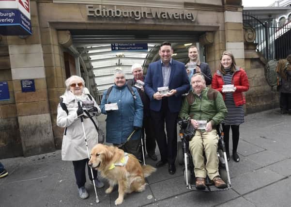 Miles Briggs launches the petition at Waverley Station along with members of the Edinburgh Access Panel. Picture: Greg Macvean