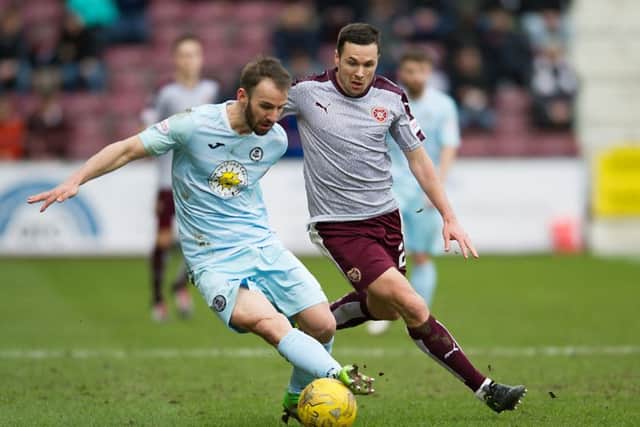 Don Cowie of Hearts and Partick's Sean Welsh battle for possession at Tynecastle last year. Picture: John Devlin