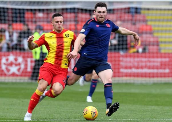 John Souttar is chased by Myles Storey