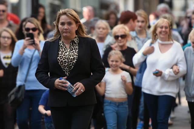 Nicola Urquhart, mother of missing RAF gunner Corrie McKeague, retraces her sons final steps in Bury St Edmunds exactly a year after his disappearance in a bid to "jog someone's memory" and solve the case. Picture: Joe Giddens/PA Wire