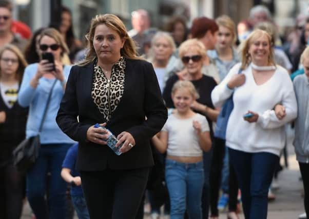 Nicola Urquhart, mother of missing RAF gunner Corrie McKeague, retraces her sons final steps in Bury St Edmunds exactly a year after his disappearance in a bid to "jog someone's memory" and solve the case. Picture: Joe Giddens/PA Wire