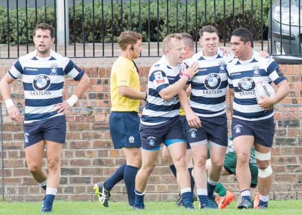 Robbie Mulveena, far right, is congratulated after scoring one of Heriots tries at Goldenacre. Picture: Ian Georgeson