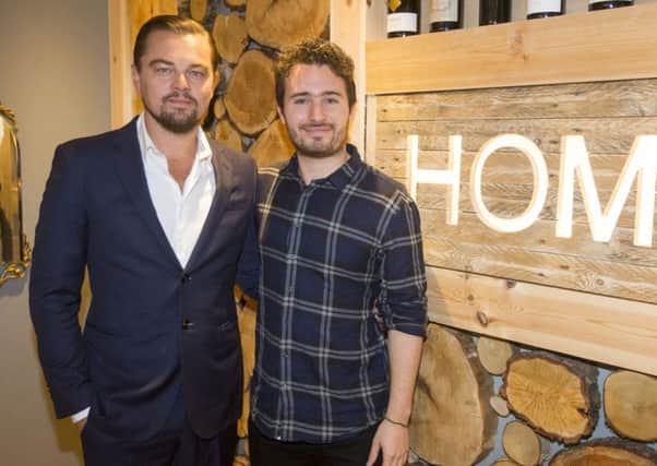 Leonardo DiCaprio poses with social entrepreneur Josh Littlejohn at Social Bite restaurant, Home last November.