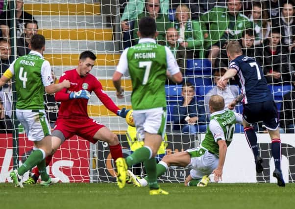 Ross Laidlaw makes his brilliant save from Ross County's Michael Gardyne