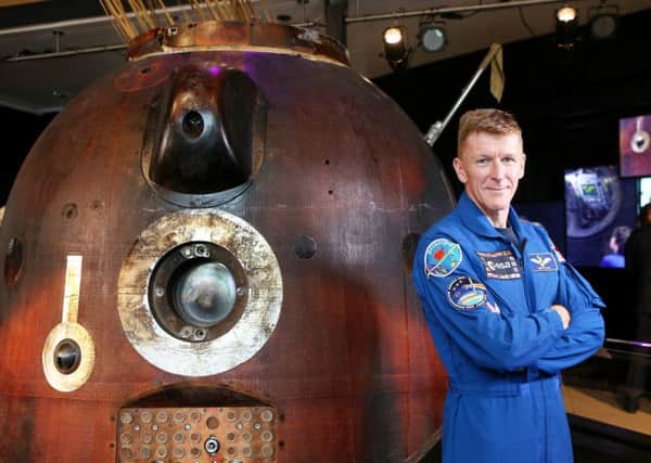 British astronaut  Major Tim Peake pictured  with the Soyuz TMA-19M - the Space capsule that brought him safely back to Earth after his stint on the International Space Station. Picture: SWNS