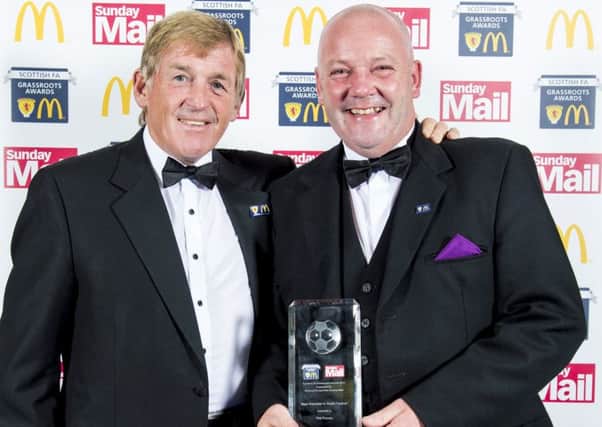Phil Purves receives his award from Kenny Dalglish. Picture: SNS