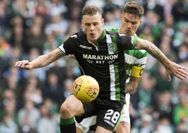Anthony Stokes shields the ball from Mikael Lustig during Hibs' 2-2 with Celtic. Pic: SNS