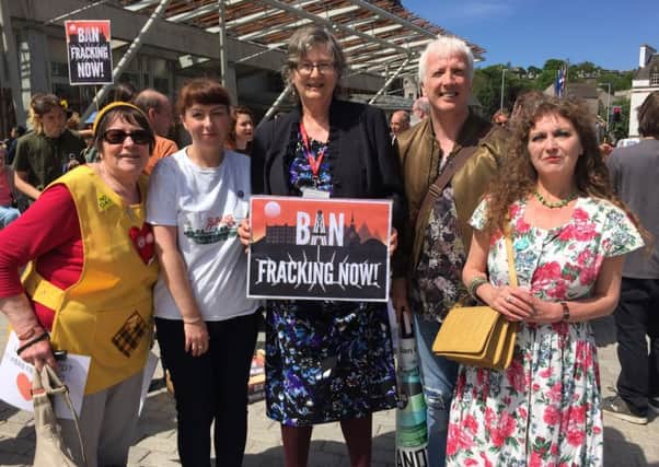 Anti-fracking campaigners attend a demo at the Scottish Parliament