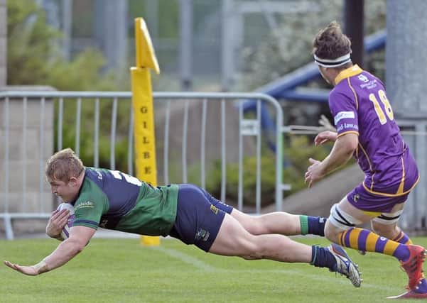 Johnny Matthews scores his second try for Boroughmuir last weekend. Pic: Neil Hanna