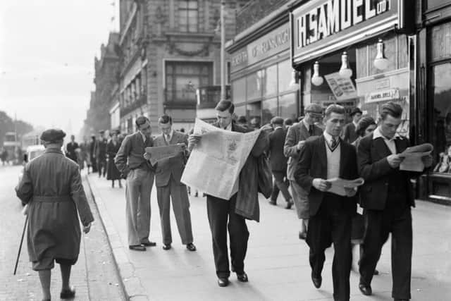 Gents catch up on the latest news, Princes Street. Picture: CC/Nationaal Archief Netherlands