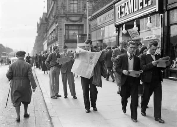 Gents catch up on the latest news, Princes Street. Picture: CC/Nationaal Archief Netherlands