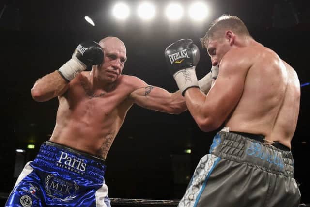 Stephen Simmons lands a left hand on opponent Simon Barclay at Meadowbank. Pic: Paul Devlin/SNS