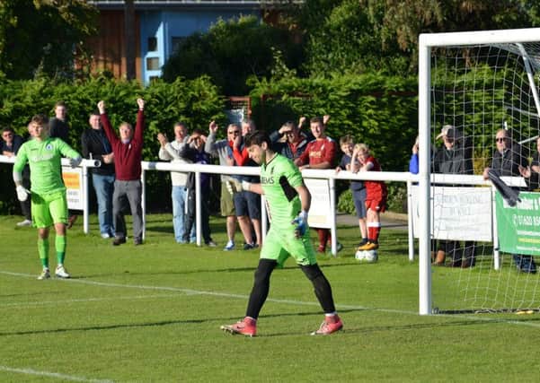 Haddington keeper Haris Alysandratos, right, reacts in the shootout, along with the contrasting fortunes of supporters