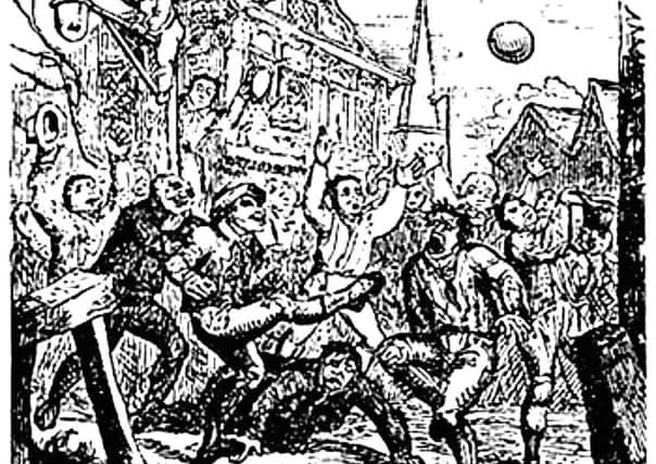 Detail of an etching of a game of street-style football being played during the medieval era. PIC: Creative Commons.