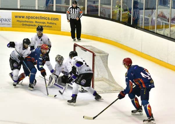 Edinburgh Capitals' Marek Tvrdon is closed down by the Braehead Clan defence. Picture: Jan Orkisz