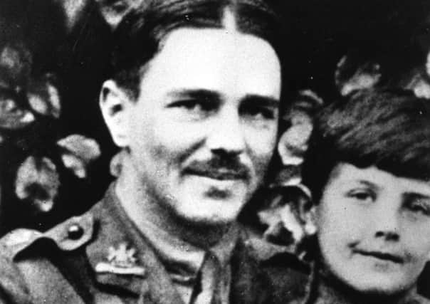 British soldier and war poet Wilfred Owen in uniform with a young boy, circa 1917. Picture: Evening Standard/Getty Images