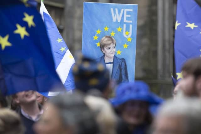 People gather at a Rally for Europe event on Edinburgh's Royal Mile. Picture: David Cheskin/PA Wire