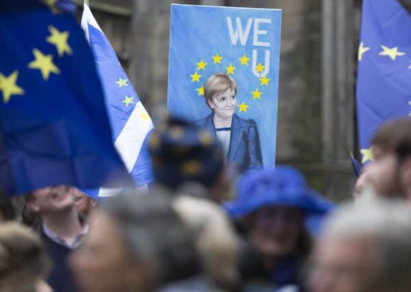 People gather at a Rally for Europe event on Edinburgh's Royal Mile. Picture: David Cheskin/PA Wire