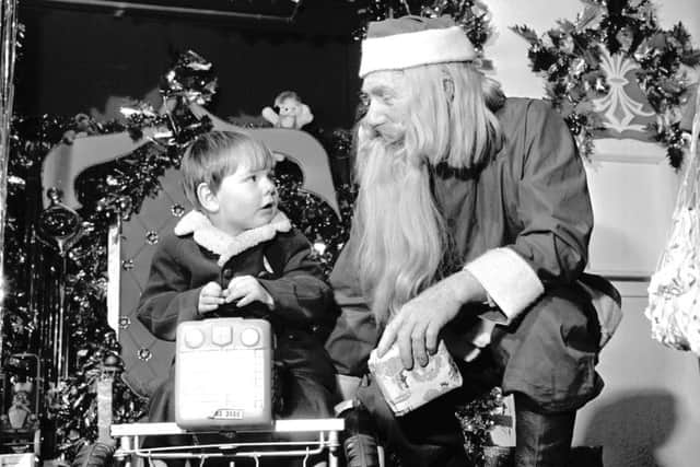 A wee boy meets Santa at Patrick Thomson department store in North Bridge Edinburgh December 1971. Picture: TSPL