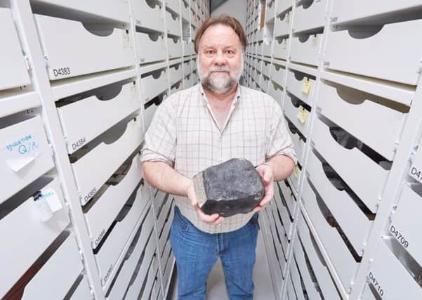 Peter Davidson with a fragment of the meteorite. Picture: contributed