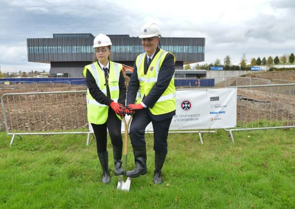 Kelsey Wallace from Castlebrae High School with Stuart Forbes to mark the start of building at Little France