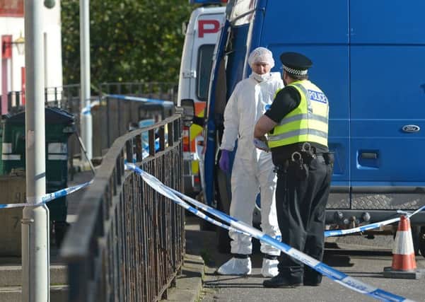 Forensic police gather evidence at the scene in Longstone.

 Picture: Neil Hanna