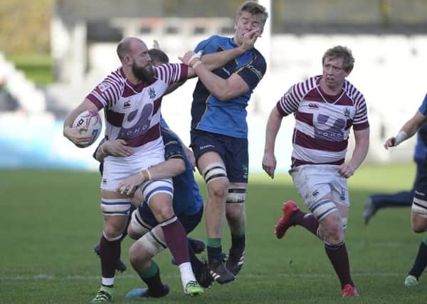 Ross Drummond retains possession for Watsonians. Pic: Neil Hanna
