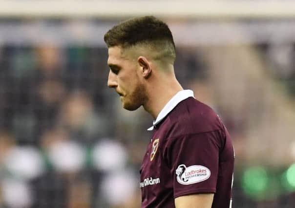 Hearts' Cole Stockton shows his dejection at full-time against Hibs. Pic: SNS