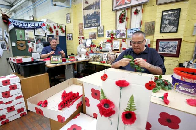 Veterans Stewart Ballantyne (left) and Gerry Lindsay assemble poppy sprays as final preparations are made ahead of this year's PoppyScotland Appeal and Remembrance Day at the Lady Haig's Poppy Factory in Edinburgh. PRESS ASSOCIATION Photo. Picture date: Tuesday October 24, 2017. The factory makes over five million poppies and 10,000 wreaths all hand assembled by the veterans who work at the factory founded in 1926 by Lady Haig, the wife of Field Marshal Haig. Photo credit should read: Jane Barlow/PA Wire