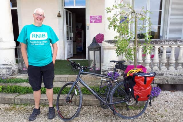 Andy Wallace pictured on a charity ride with the bike that has since been stolen. Picture: contributed