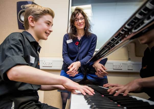 Xander Proud with Piano Teacher Lynda Cochrane during an open day last year
