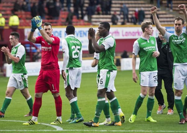 Hibs' players celebrate at full-time after winning 1-0 at Motherwell. Pic: SNS