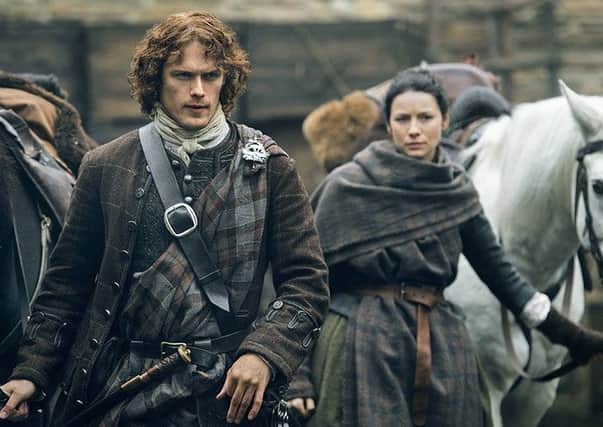 Sam Heughan as Jamie Fraser and Catriona Balfe as Claire Fraser in Outlander. Picture: Starz TV
