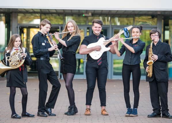 City of Edinburgh Music School pupils Esme McBride-Stewart, Ross Dickson, Hanna Brooks, Harry Noble, Harmony Rose-Bremner and Sean Hughes 
welcome parents to an open day last year. Picture: Ian Georgeson