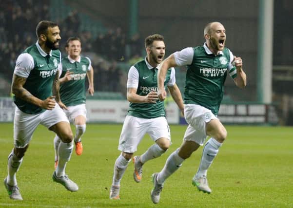 David Gray, far right, runs away to celebrate after opening the scoring from a corner. Liam Fontaine, Liam Henderson and James Keatings are in chase