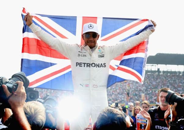 Lewis Hamilton celebrates after winning his fourth F1 World Drivers Championship. Picture: Getty