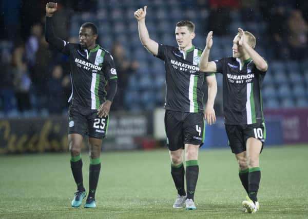 Efe Ambrose, Paul Hanlon and Dylan McGeouch hail the Hibs fans after a 3-0 win over Kilmarnock. Pic: SNS