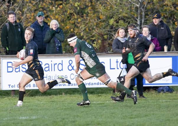 Harvey Elms runs clear on his way to a try for Currie. Pic: Alistair Linford