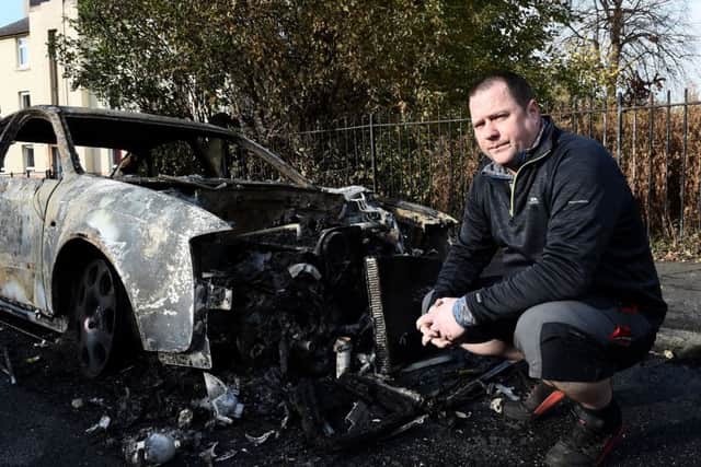Alistair Clark with his Audi that was set alight. Picture: Lisa Ferguson