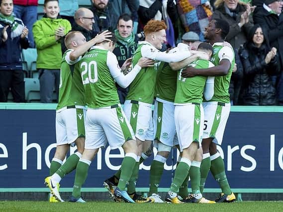 Martin Boyle is mobbed by his jubilant team-mates after opening the scoring after just 63 seconds against Dundee at Easter Road