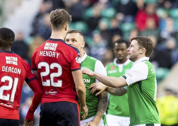 Anthony Stokes and Jack Hendry square up at Easter Road