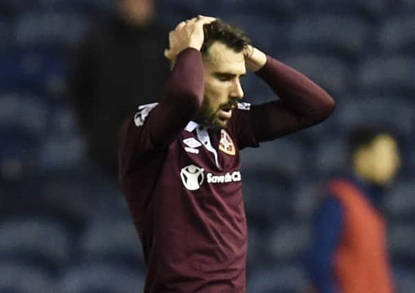 Hearts defender Michael Smith feels the pain of Sunday's defeat by Kilmarnock